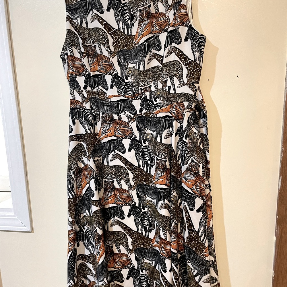 This dress was purchased at Columbus Zoo. Has zoo animals on it. Full skirt.